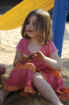 Isabelle playing in the sand at Coogee playground